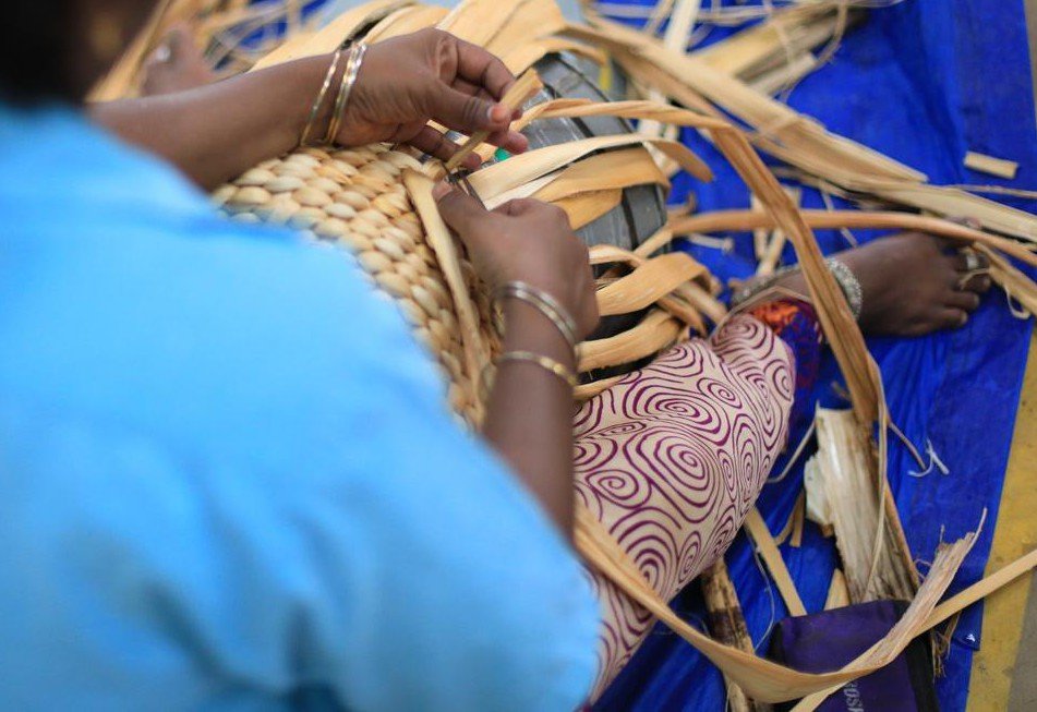 Women artisans weaving handmade products
